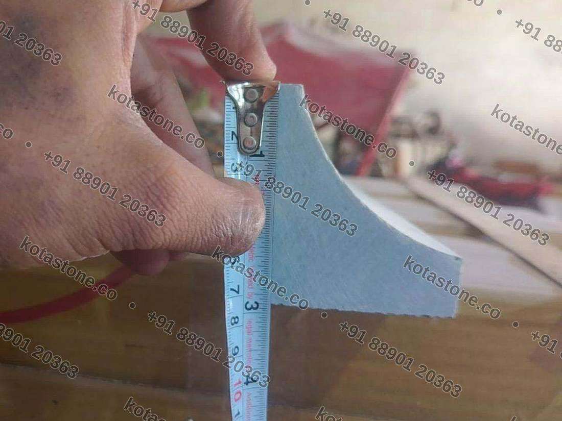 Coving section held against a steel rule to show the cove depth