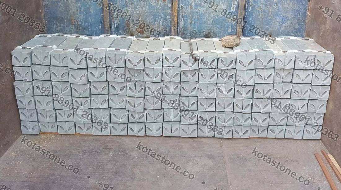 Kota stone coving stacked profile-face out, showing the repeated concave cove section