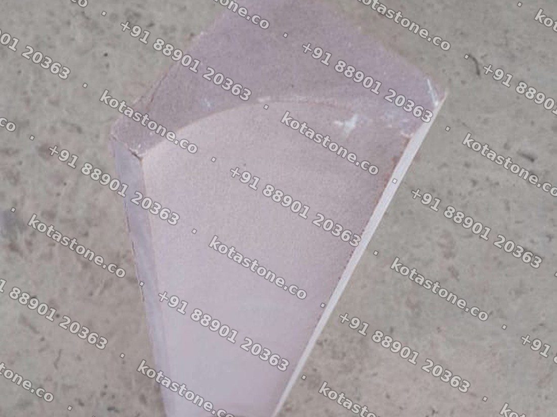 Mandana stone coving piece showing the concave sweep and the cut ends