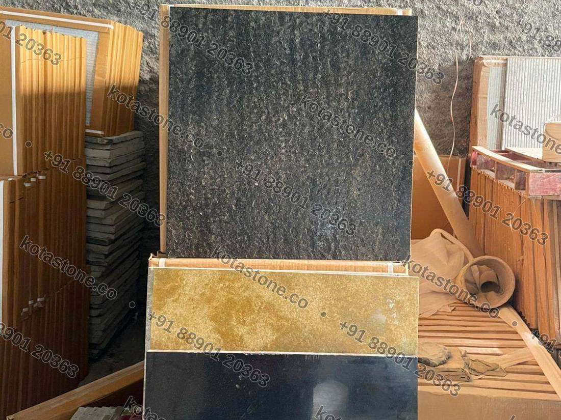 Black, gold and dark textured faces — designer tile board at our unit