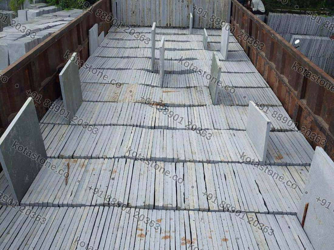 A load being built with stone dividers