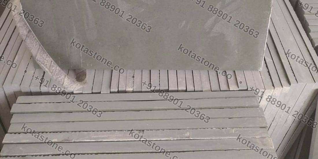 Calibrated Kota slabs stacked on edge, showing the ground edges that prove machine-controlled thickness