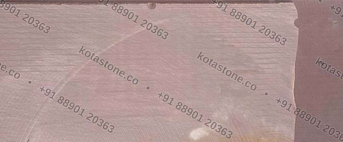 Wide detail of a diamond-polished Mandana slab showing the arc of the polishing head